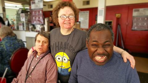 three people in a group photo 